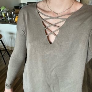 tan/green sweater w/ crisscross neck